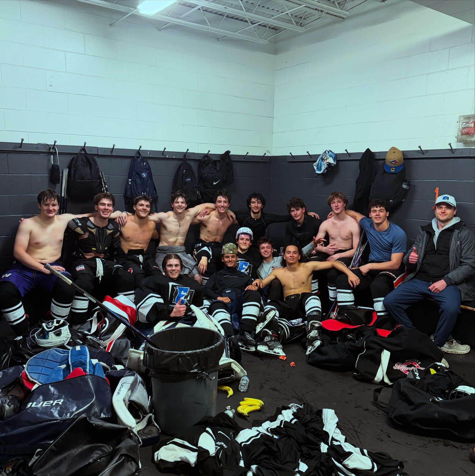Team celebrating together in the locker room